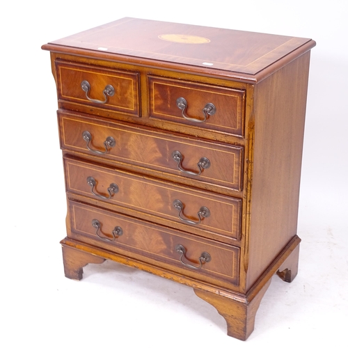 2162 - A mahogany crossbanded and satinwood-strung chest of small size, with 2 short and 3 long drawers, on... 