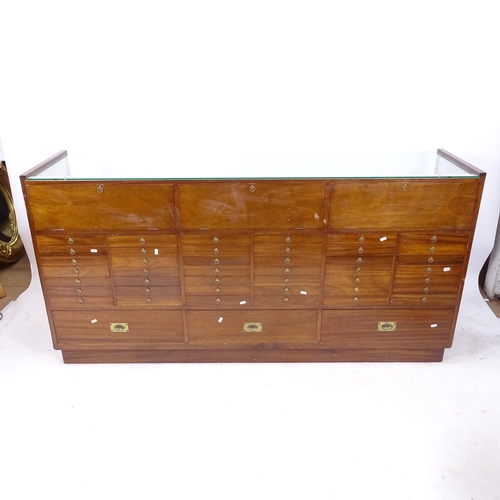 2000 - A mid-century teak-framed shop haberdashery cabinet, with 45 fitted drawers, L181cm, H91cm, D46cm