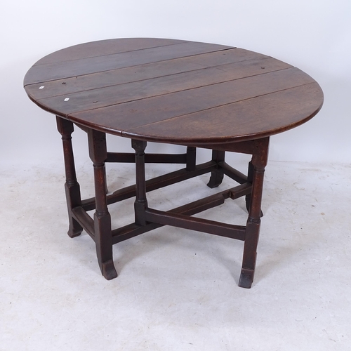 2178 - An Antique oak oval gateleg table, W106cm, H69cm, D39cm