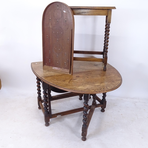 2180 - An oak oval barley twist gateleg table, an oak barley twist occasional table, and a Corinthian 21T b... 