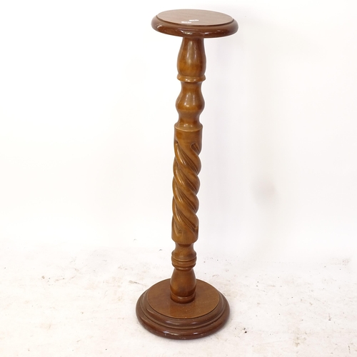 2189 - A mahogany candles stand, on a spiral turned column and platform base, H92cm