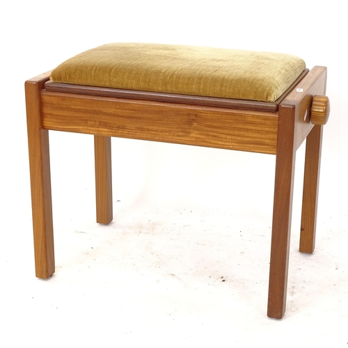 2192 - A mid-century teak rise and fall piano stool, with upholstered seat, by Duckson & Pinker Ltd, label ... 