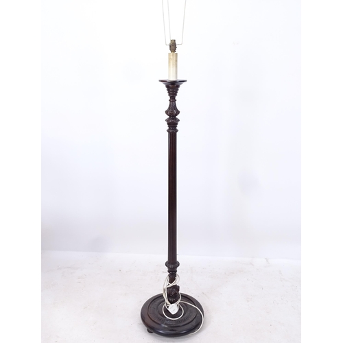 2202 - A fluted mahogany standard lamp, height to top of bayonet fitting 144cm