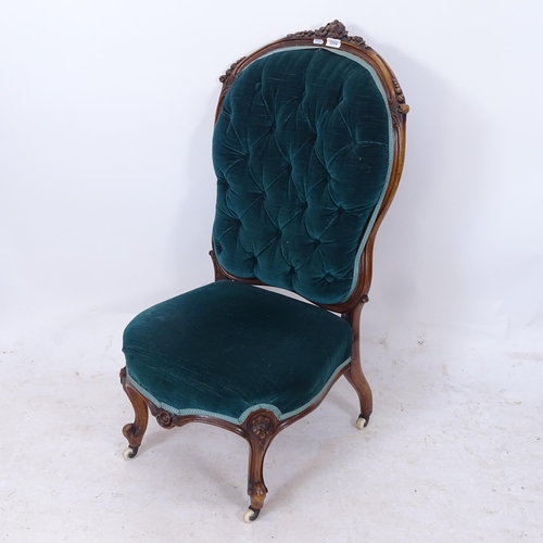 2204 - A Victorian carved walnut-framed and upholstered nursing chair