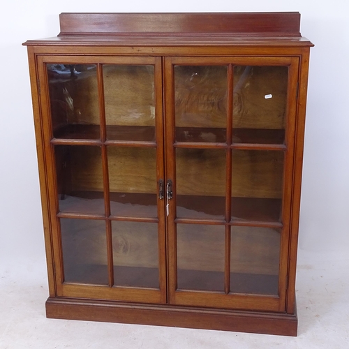 2206 - An Edwardian mahogany bookcase, with 2 lattice-glazed doors, on plinth base, with key, W110cm, H130c... 