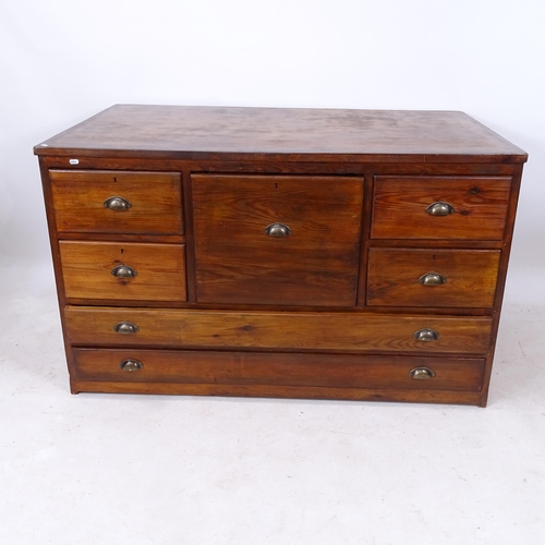 2210 - An early 20th century pine-framed bank of 7 various drawers, with brass cup handles, W138cm, H82cm, ... 