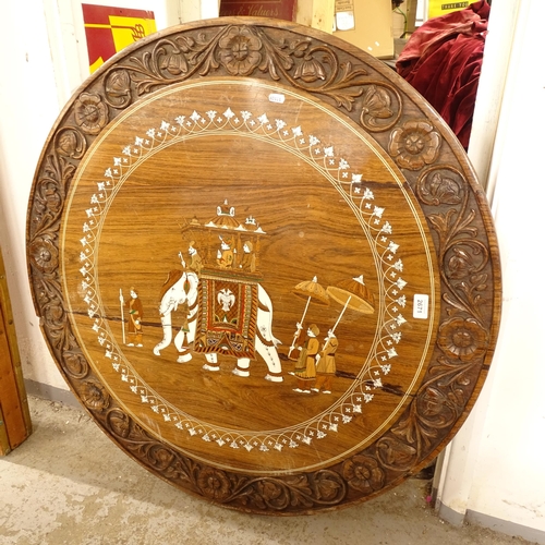 2671 - A carved and bone inlaid Anglo-Indian circular occasional table top, with design depicting an elepha... 