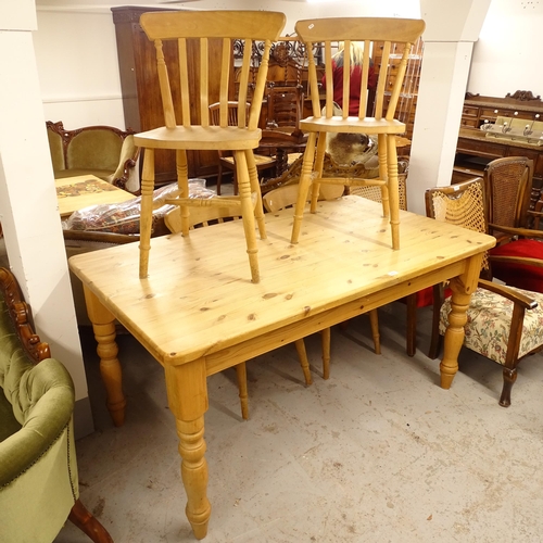 2678 - A pine kitchen table on turned legs, L150cm, H77cm, D87cm, and a set of 4 pine kitchen chairs