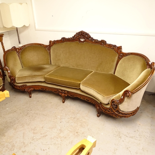 2700 - A large bow-end 3-seater settee of serpentine form, with stained beech show-wood, L240cm