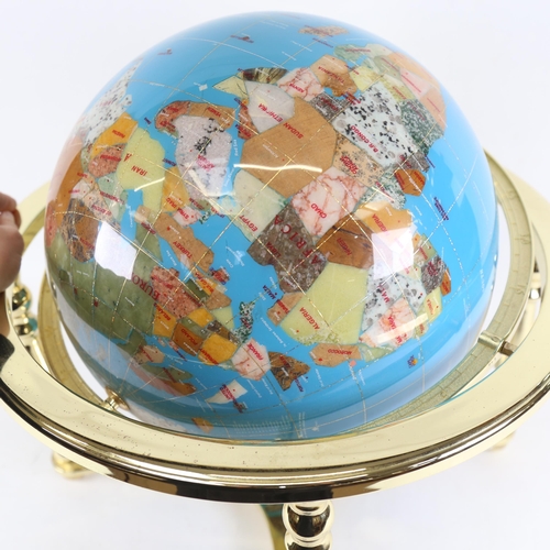 110 - A reproduction brass and hardstone table-top terrestrial globe, with compass inset base, overall hei... 