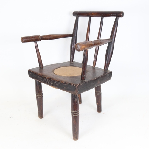 113 - A child's oak stick-back commode chair, height 50cm