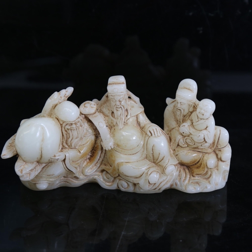 124 - A Chinese polished jade elder figure group, length 16cm