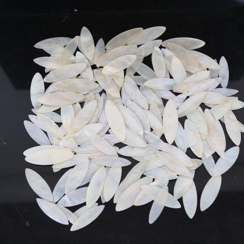 129 - A quantity of Chinese engraved mother-of-pearl navette gaming counters