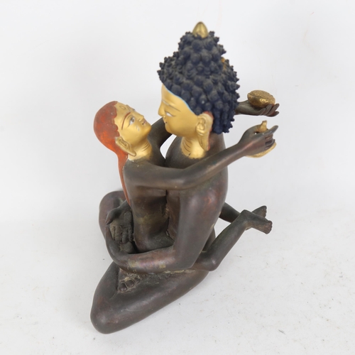 187 - A Chinese hand painted and gilded patinated bronze seated Buddha figure, height 23cm