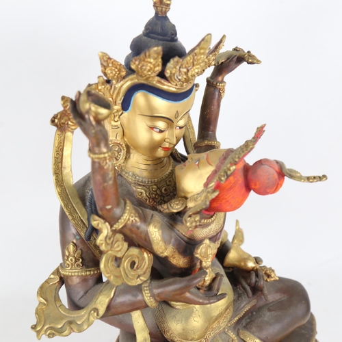 188 - A large Chinese hand painted and gilded patinated bronze seated Buddha, on double-lotus base, overal... 