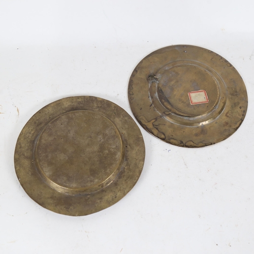 213 - A Buddhist silver and copper overlaid brass roundel plaque, and an Eastern brass stone set dish, dia... 