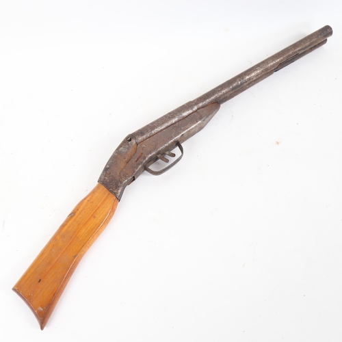 62 - A child's spring loaded double-barrelled gun, length 60cm