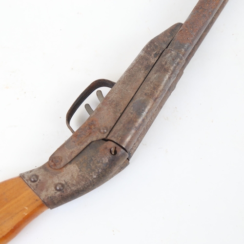 62 - A child's spring loaded double-barrelled gun, length 60cm