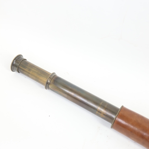 69 - A large leather-covered 2-draw telescope, extended length 103cm