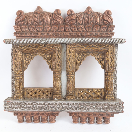 84 - An ornate painted temple design double photo frame, 43cm x 41cm