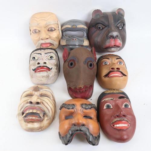 86 - 9 modern Balinese painted wood ceremonial masks, and two modern oriental prints (11).