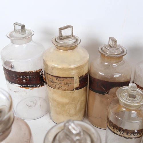 261 - A group of Antique glass chemist's apothecary jars, most with original labels, largest height 26cm