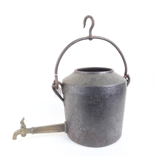 306 - Large cast-iron water dispensing cauldron, height 30cm