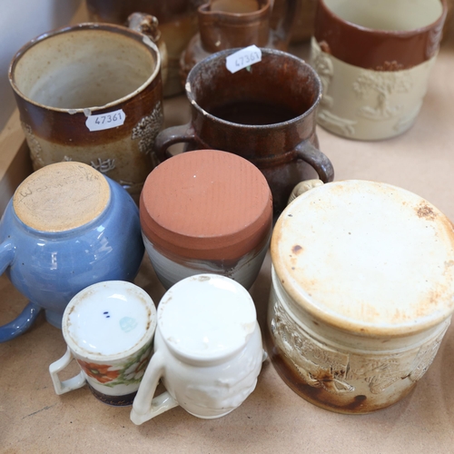 323 - A group of stoneware jugs and mugs, including Doulton Lambeth