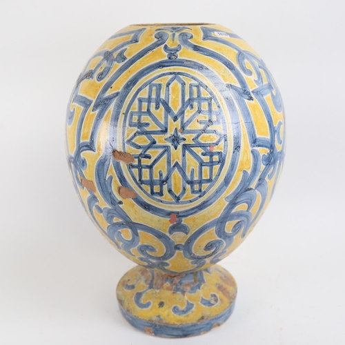 340 - Large Islamic tin-glaze terracotta egg vase, height 46cm (A/F)