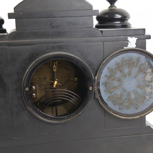 388 - A large black slated architectural 8-day mantel clock, movement striking on a gong, case height 29cm