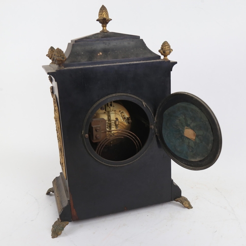 390 - Ebonised and gilded 8-day mantel clock, movement striking on a gong, case height 36cm