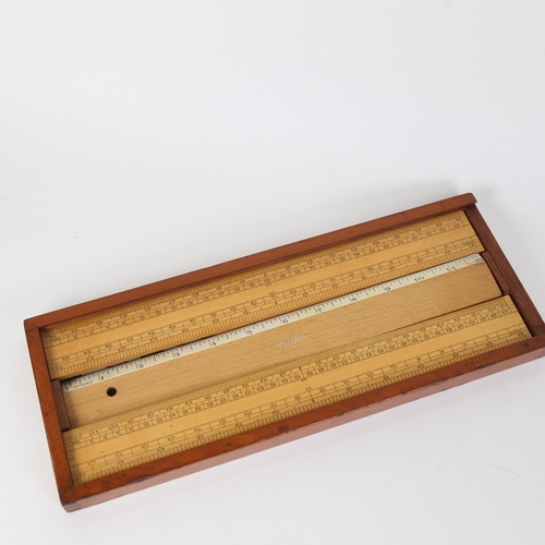 430 - A mahogany-cased boxwood and other rulers