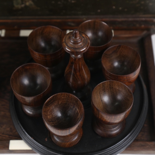 435 - A Wartime box for a telephone, a leather-covered mallet, length 30cm, turned wood eggcups on stand, ... 