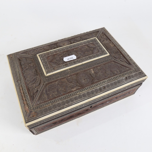 446 - Antique Anglo-Indian carved work box, with fitted interior and original mirror, length 25cm