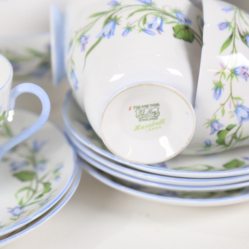 477 - Shelley tea service in Harebell pattern, including teapot