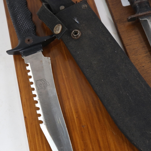 497 - A Second World War USM8 Camillus knife in sheath, and a Commando knife in sheath, both with wall dis... 