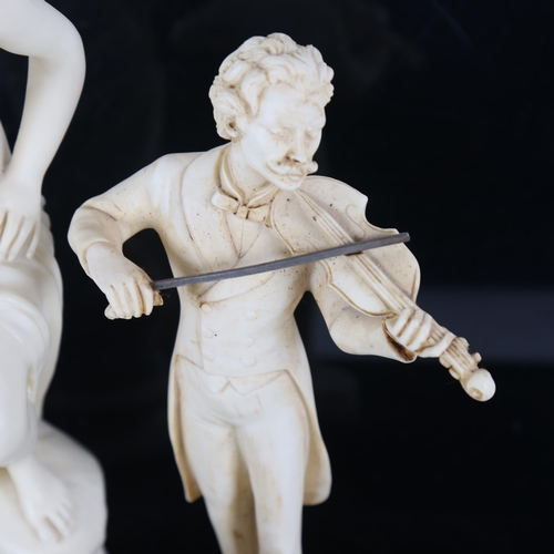 499 - A composition figure of a Classical lady, 23cm, a cherub, and a violinist