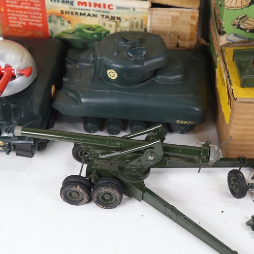 528 - Various boxed toys including a Britains 155MM gun, a Howitzer, Tri-ang tank, and a Tri-ang rocket fi... 