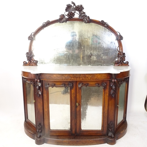 2002 - A Victorian walnut bow-front chiffonier, with raised mirror-back, shaped marble top, and mirrored gl... 