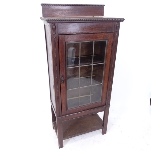 2109 - An early 20th century oak display cabinet/bookcase, with lattice-glazed door and 2 fixed shelves, W6... 