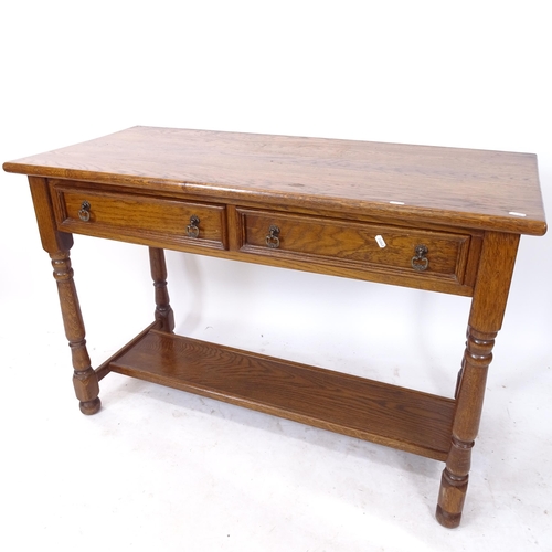 2110 - An oak hall table, with 2 frieze drawers and shelf under, on baluster turned legs, W117cm, H77cm, D5... 