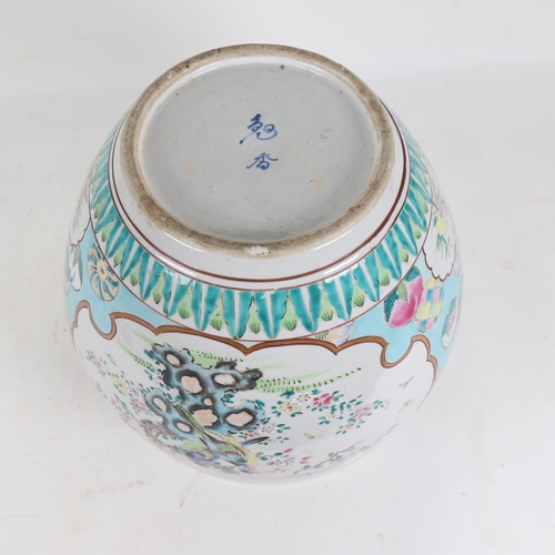 565 - A Chinese jardiniere with enamelled decoration, signed, height 26cm