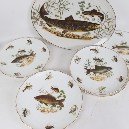 566 - A 7-piece fish set with printed decoration, platter length 39cm