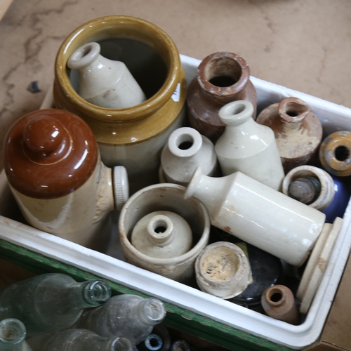 579 - Stoneware jars and bottles, and a box of glass dug up bottles and jars