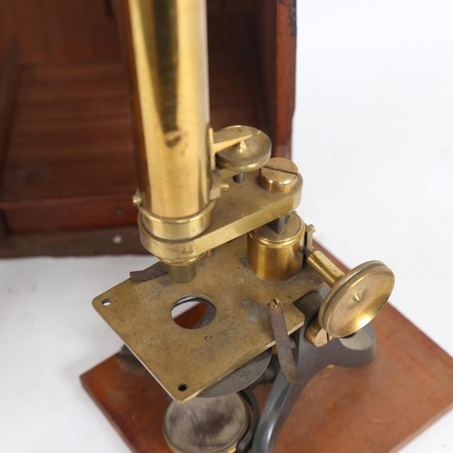 596 - A brass student's microscope in mahogany case