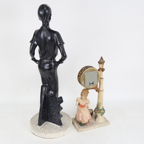 624 - A figure of a lady in a black dress, 52cm, and a clock with child figure support