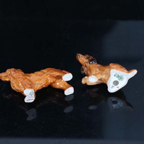 709 - A Royal Worcester Cocker Spaniel dog, model no. 2944, and another, height 6cm (2)