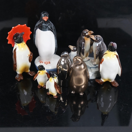 711 - Beswick porcelain penguin family, Rye Pottery penguin etc