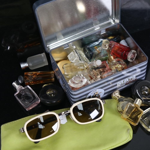 723 - A pair of Dolce & Gabbana sunglasses, DG903S, and various luxury designer perfume miniatures