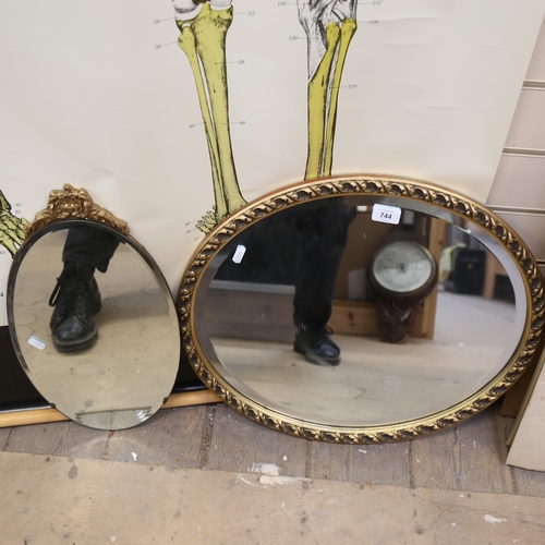 744 - 2 oval gilt-frame wall mirrors